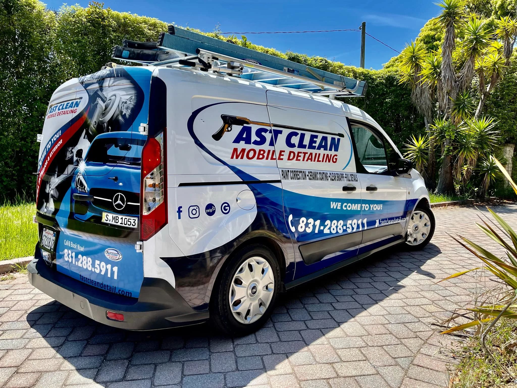 Fast Clean Mobile Detailing branded van parked in a residential driveway, set up for a mobile appointment.