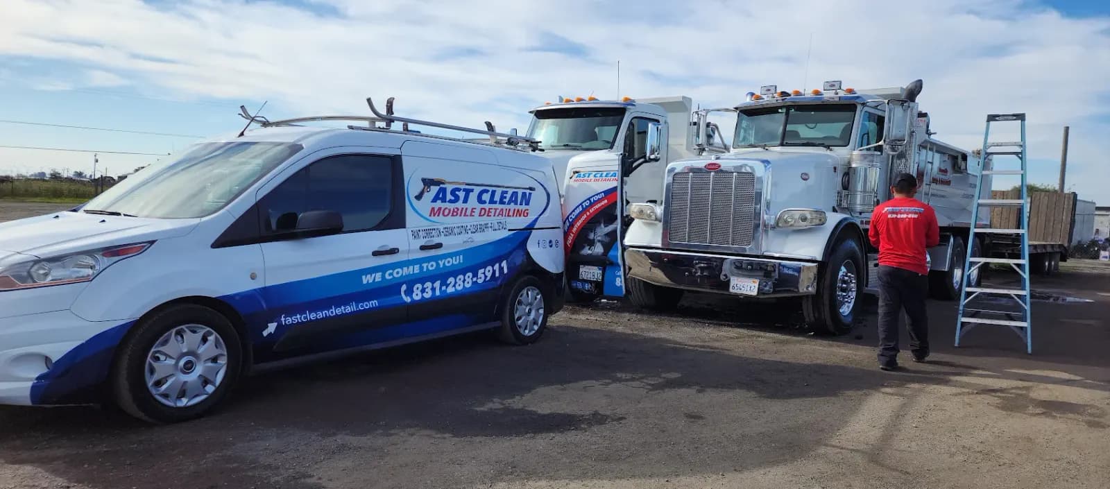 Fast Clean Mobile Detailing branded van parked on a job site next to commercial trucks.