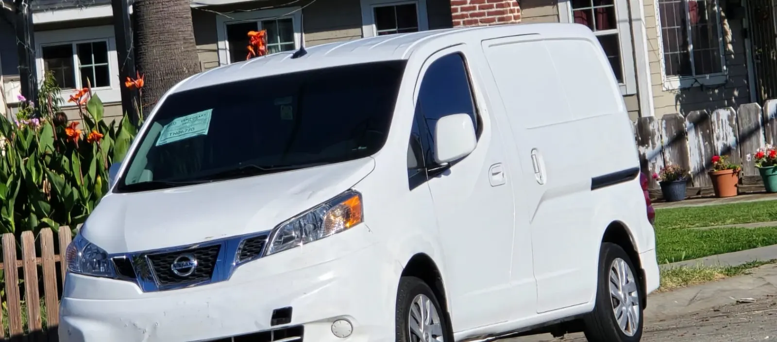 White cargo van parked on a residential street after a mobile detail by Fast Clean Mobile Detailing.